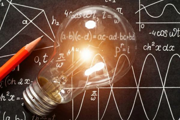A glowing light bulb rests on a chalkboard with mathematical formulas. A red pencil lies nearby. The scene conveys innovation and learning.