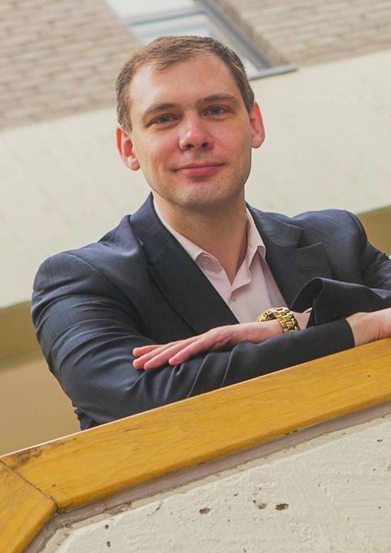 Alexander Orlov leaning over a balcony