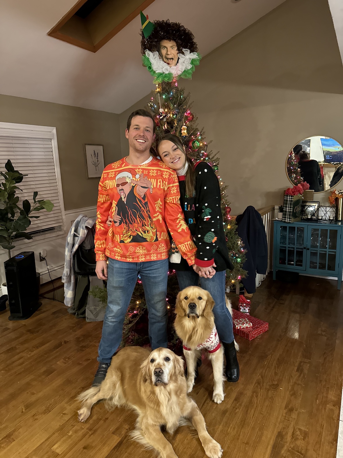 Freddie, Shannon, Finn and Arfur posing in front of a decorated Christmas tree